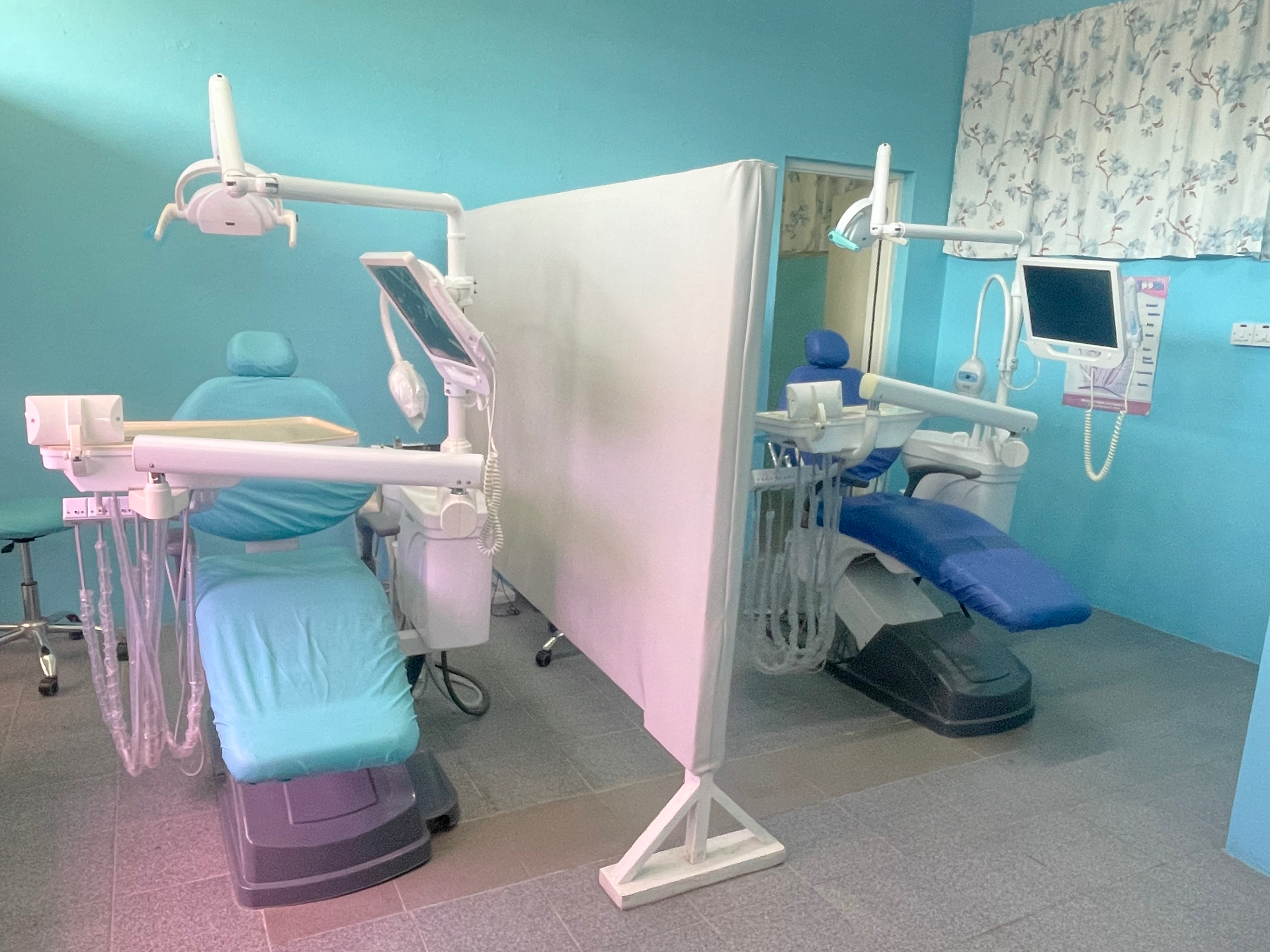 Spacious treatment room with two dental chairs